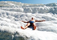 A man sunbathing at the cotton castles of Pammukale