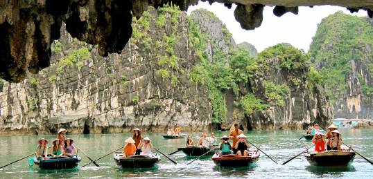 On The Go passengers in sampans on a Vietnam Tour