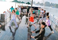 Early morning Tai Chi on a junk in Halong Bay on a Vietnam Tour