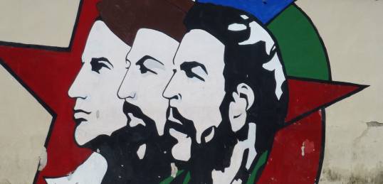 Wall paintings of Cubas Revolutionaries in Havana as seen on our Cuba Tours.