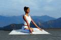 A woman practising yoga at the luxury Ananda Spa Resort at the foothills of the Himalayas
