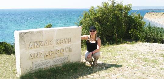 A girl next to the ANZAC Cove sign in Gallipoli