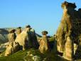 Setting sun on the rock formations in Cappadocia