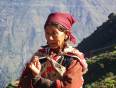 A Nepalese lady stands in the Himalayas