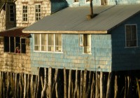 Traditional palafitos, fishermen's houses on stilts, in Chiloe on a Chile Tour