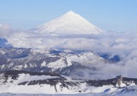 The mountains of Pucon covered in snow during the winter months - a perfect time to take a Chile Tou