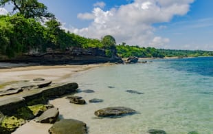 A secluded beach in Mozambique with sparkling water