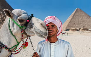 Camel man and Pyramids of Giza - Egypt Tours - On The Go Tours