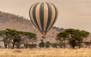 Hot air balloon flying over the Serengeti National Park