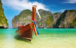 Long boat and beach - Best time to visit Thailand - On The Go Tours