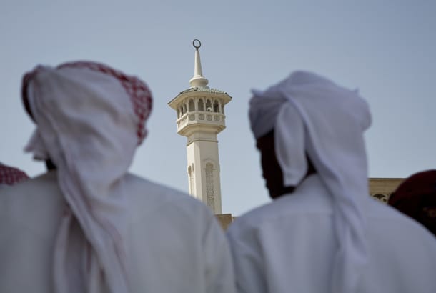 Emirati men in front of mosque - Essential Dos and Don'ts in Dubai - On The Go Tours