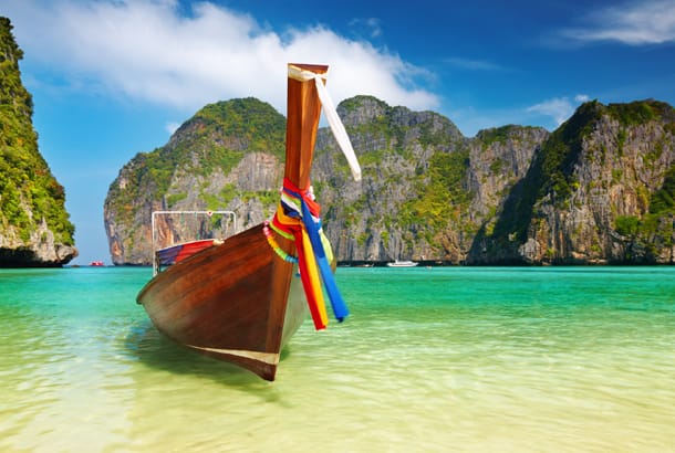 Long boat and beach - Best time to visit Thailand - On The Go Tours