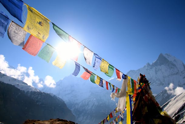 Mountains and prayer flags - Nepal best time to visit - On The Go Tours