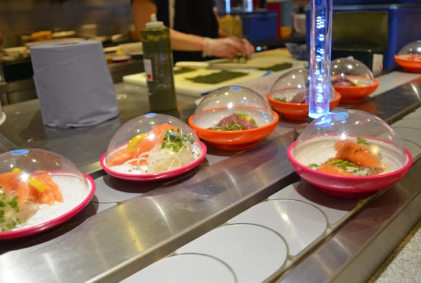 Sushi on a conveyor belt in restaurant