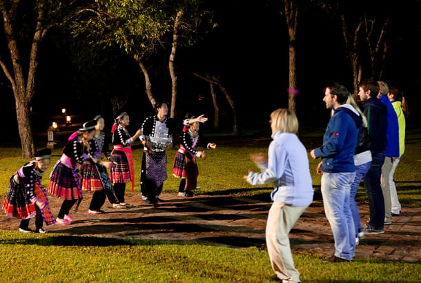Visitors and hill tribe at the Hmong Lodge, Thailand