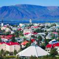 Colourful houses of Reykjavik against a backdrop of snowy mountains