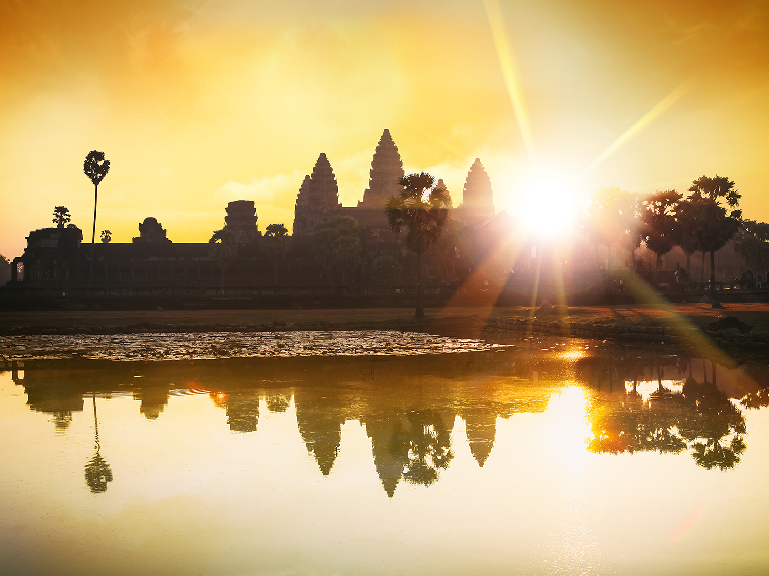 Sunrise at Angkor Wat in Cambodia, bathed in the rising sunlight