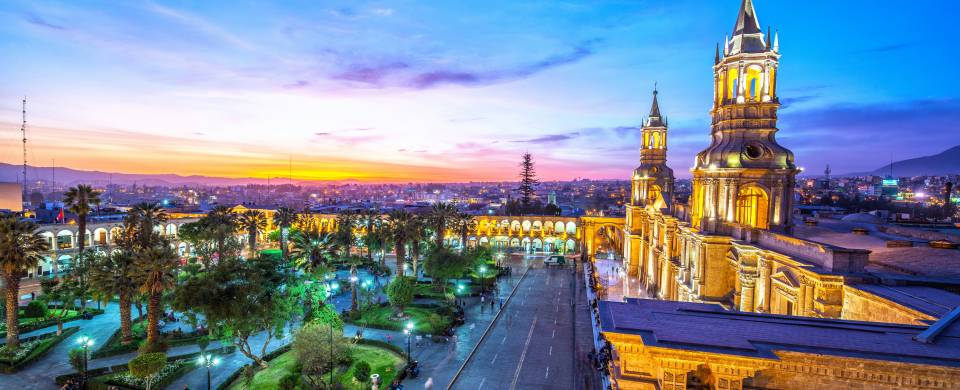 Main plaza in Arequipa sparkling with bright lights at night