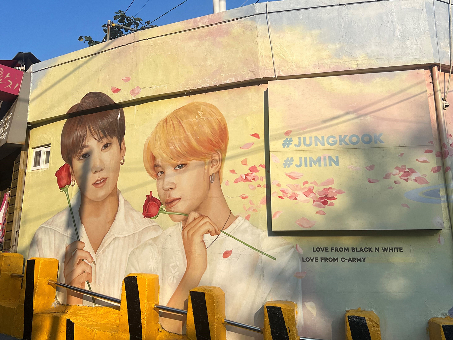 a mural of Jimin and Jungkook from BTS
