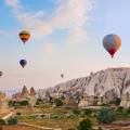 Hot air balloons floating over the stunning landscape of Cappadocia