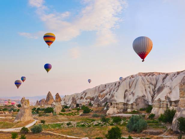 Hot air balloons floating over the stunning landscape of Cappadocia