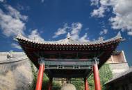 A stone stele housed beneath a traditional Chinese roof in Xian's Beilin Museum