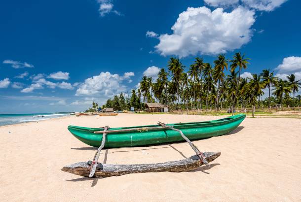 Boat on the beach in Trincomalee - Sri Lanka Tours - On The Go Tours