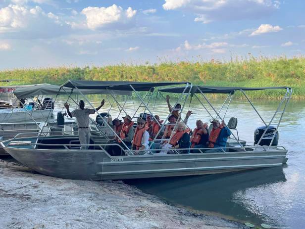 Mokoro boat gliding along the Okavango River