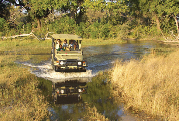 a 4x4 driving thought the Okavango Delta