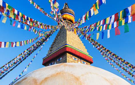 Boudhanath Stupa in Kathamandu prayer flags - Nepal Tours - On The Go Tours