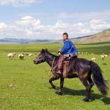 Boy riding horse in the countryside | Trans Siberian Railway