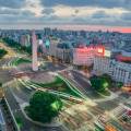 Bright lights of the cityscape behind boats on the hardbour in Buenos Aires