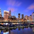 Bright lights of the cityscape behind boats on the hardbour in Buenos Aires