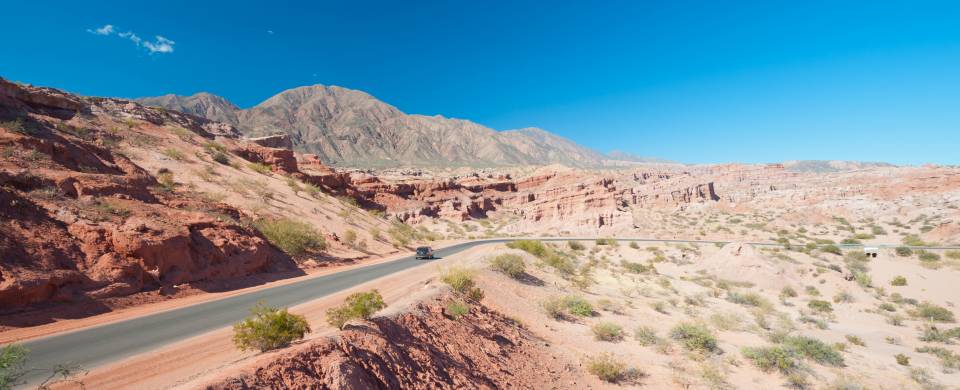 Road stretching out across the barren landscape of Cafayate