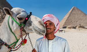 Camel man and Pyramids of Giza - Egypt Tours - On The Go Tours