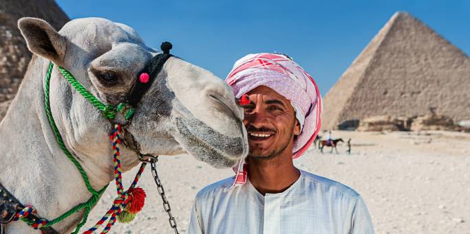 Camel man and Pyramids of Giza - Egypt Tours - On The Go Tours