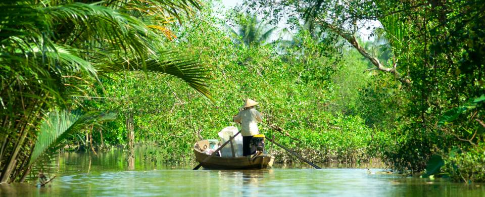 Boat making its way along the Mekong Delta near Can Tho