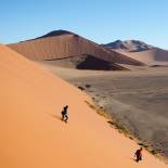 Woman walking on Dune 45 | Namibia 