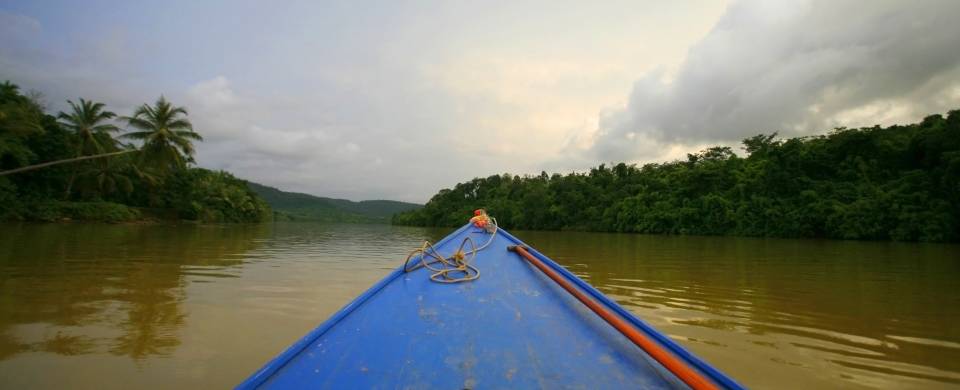 Boat making its way along the water in the Chi Phat