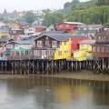 View of houses on stilts along the waterfront of Chile