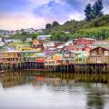 View of houses on stilts along the waterfront of Chile