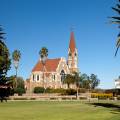 Church in Windhoek with palm trees and bright blue sky