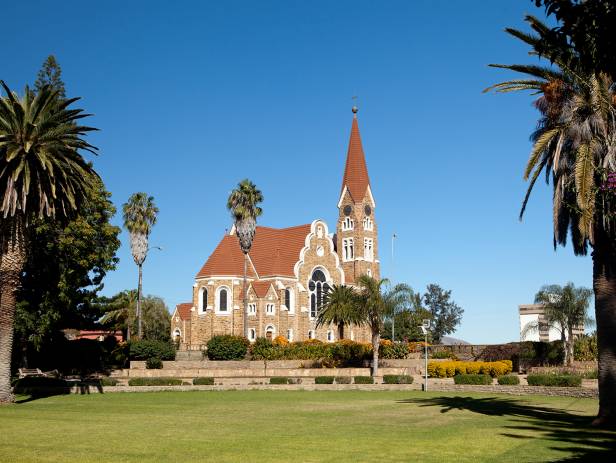 Church in Windhoek with palm trees and bright blue sky