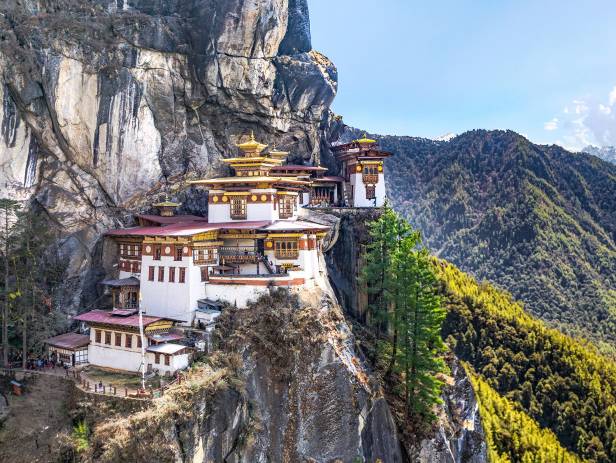 The Tiger Nest temple sitting precariously on the side of a cliff in Paro