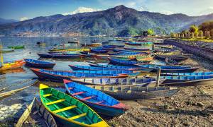 Colourful boats on Lake Phewa in Pokara - Nepal Tours - On The Go Tours