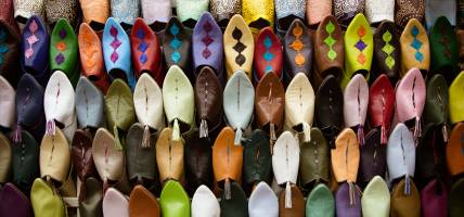 Colourful shoes in a Fes market - Morocco Tours - On The Go Tours