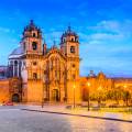 Looking out across the rooftops around the Plaza de Armas in Cuzco with the Andean mountains in the 