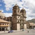 Looking out across the rooftops around the Plaza de Armas in Cuzco with the Andean mountains in the 