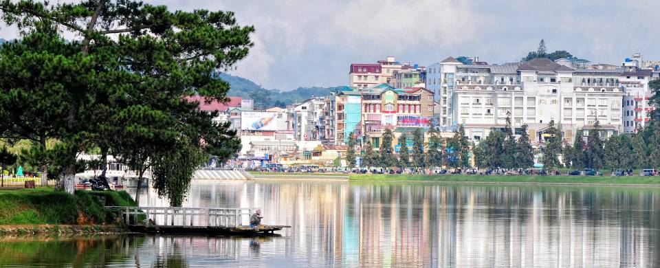 The gorgeous cityscape of Dalat being reflect off of the shimmering water
