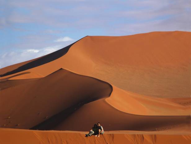 Orange sand dunes stretching into the distance at Sesriem